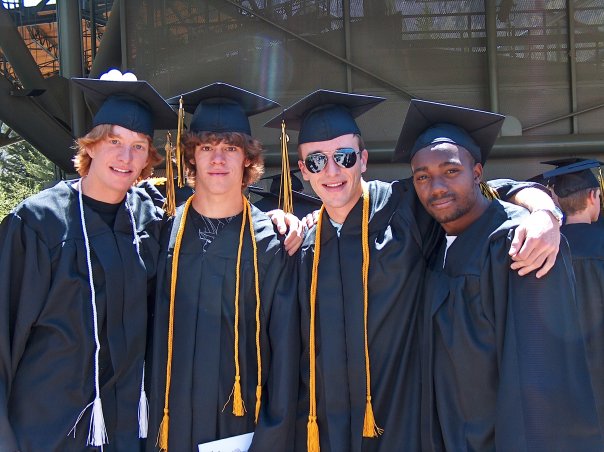 Todd (far left), and I (second from left) on graduation day. We had the whole world in front of us.